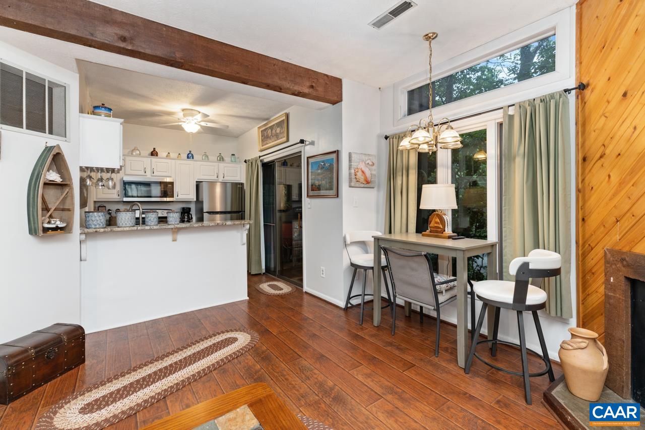 482 3 Ridges Roseland, VA 22967 - Photo 7 of 15 a room with stainless steel appliances kitchen island granite countertop furniture and a window