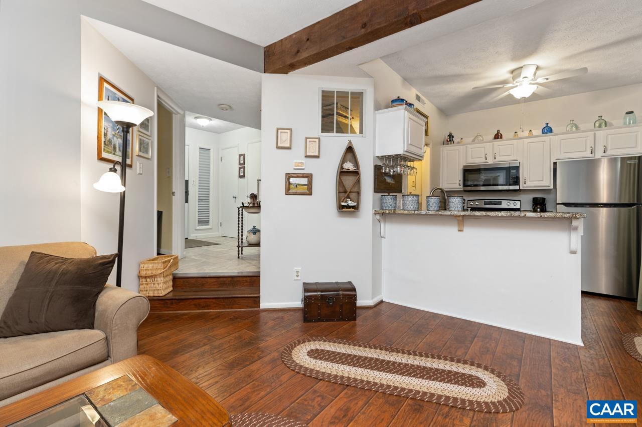 482 3 Ridges Roseland, VA 22967 - Photo 8 of 15 a living room with stainless steel appliances furniture and a view of kitchen