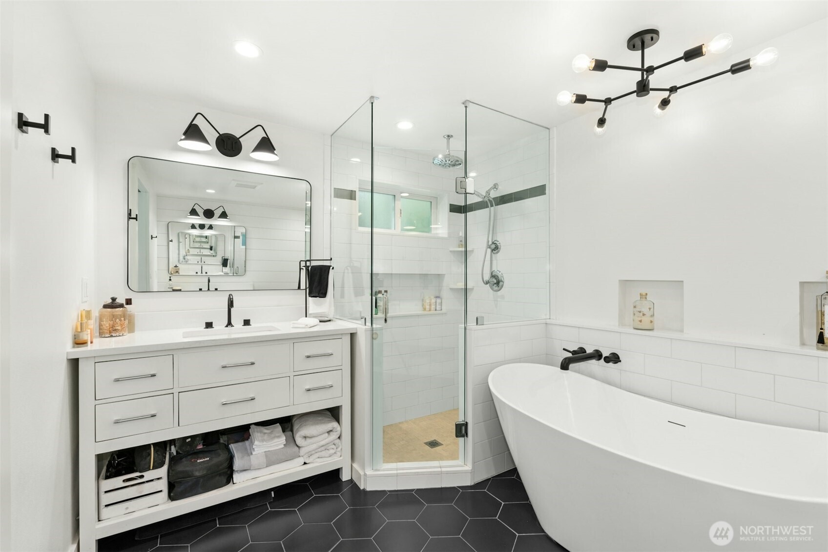23307 49th Avenue Southeast Bothell, WA 98021 - Photo 16 of 37 a bathroom with a bathtub a sink and a mirror