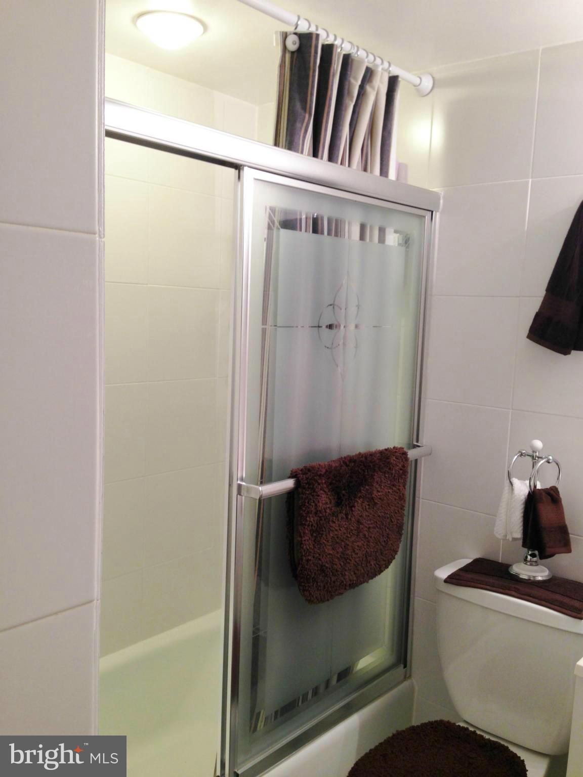 1411 Northgate Square, Unit 2A Reston, VA 20190 - Photo 9 of 26 Tiled Bathroom