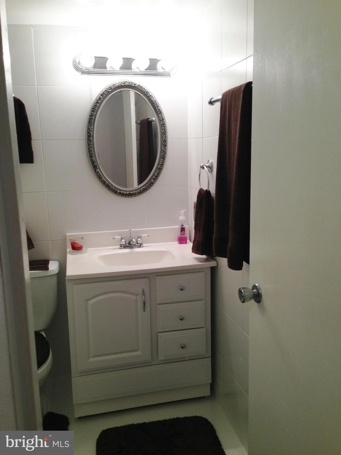 1411 Northgate Square, Unit 2A Reston, VA 20190 - Photo 10 of 26 Tiled Bathroom