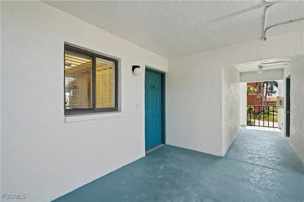 a view of an empty room with glass door