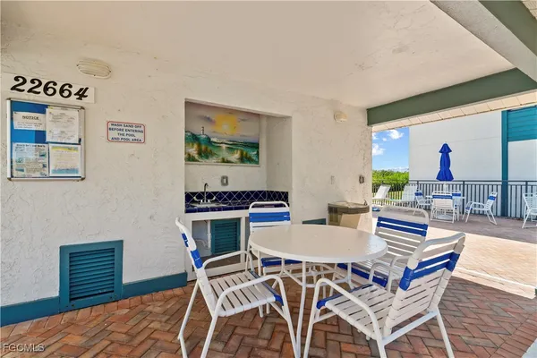 an aerial view of a house with a garden and lake view