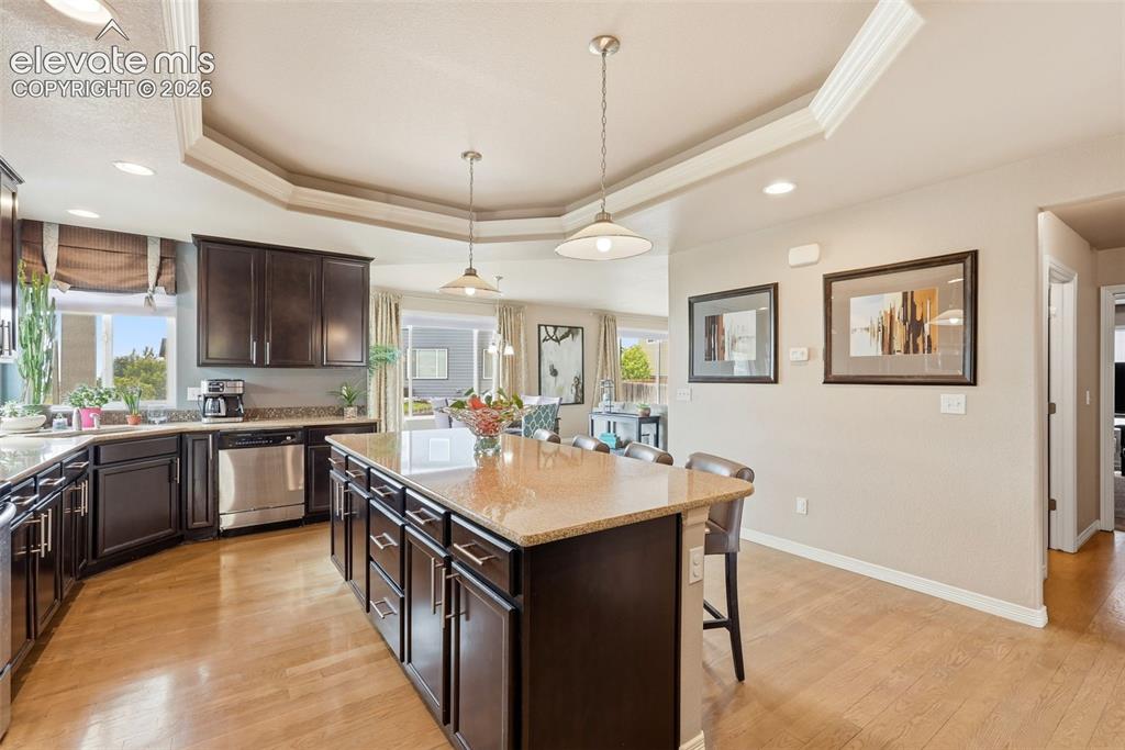 2264 Reed Grass Way Colorado Springs, CO 80915 - Photo 11 of 50 a large kitchen with cabinets a sink and stainless steel appliances