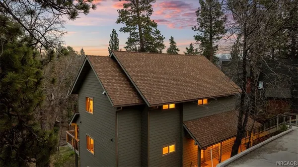 a aerial view of a house with a yard