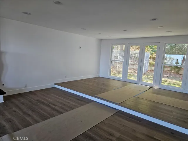 a view of an empty room and window