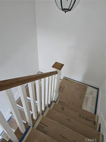 a view of a hallway with staircase