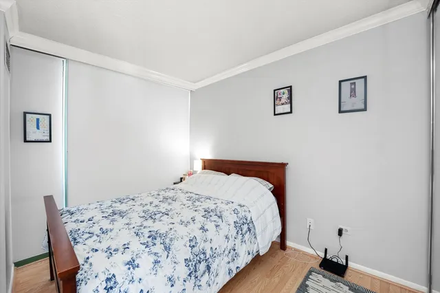 a bedroom with a bed and a table in it