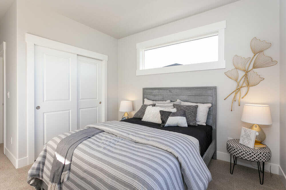 3803 Northeast Oakside Loop Bend, OR 97701 - Photo 17 of 22 a bedroom with a bed and a window