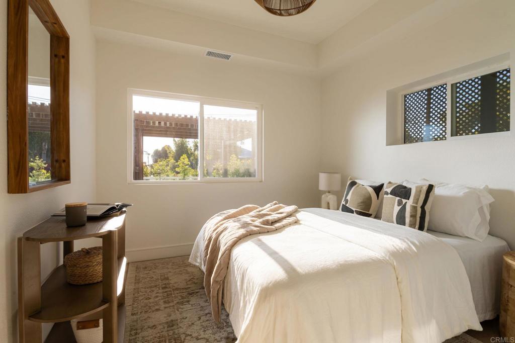 1551 Burgundy Road Encinitas, CA 92024 - Photo 30 of 45 a bedroom with bed and a window