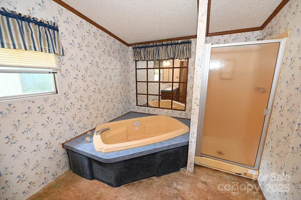 a room with window and a shower