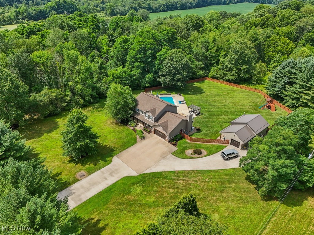 230 South Medina Line Road Akron, OH 44321 - Photo 46 of 50 Aerial view of property and surrounding area with a heavily wooded area
