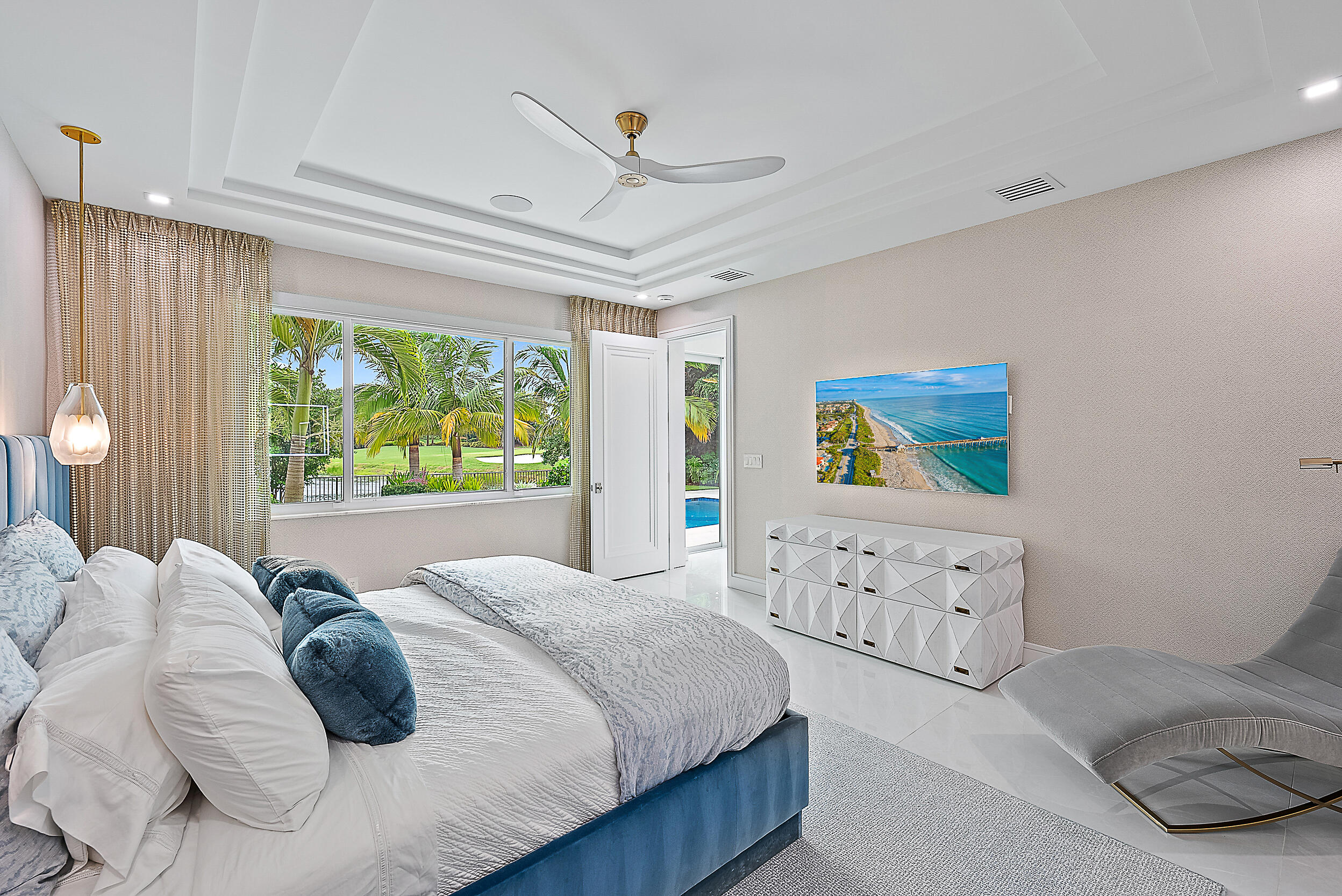 134 Golf Village Boulevard Jupiter, FL 33458 - Photo 16 of 48 a bedroom with a bed and a painting on the wall
