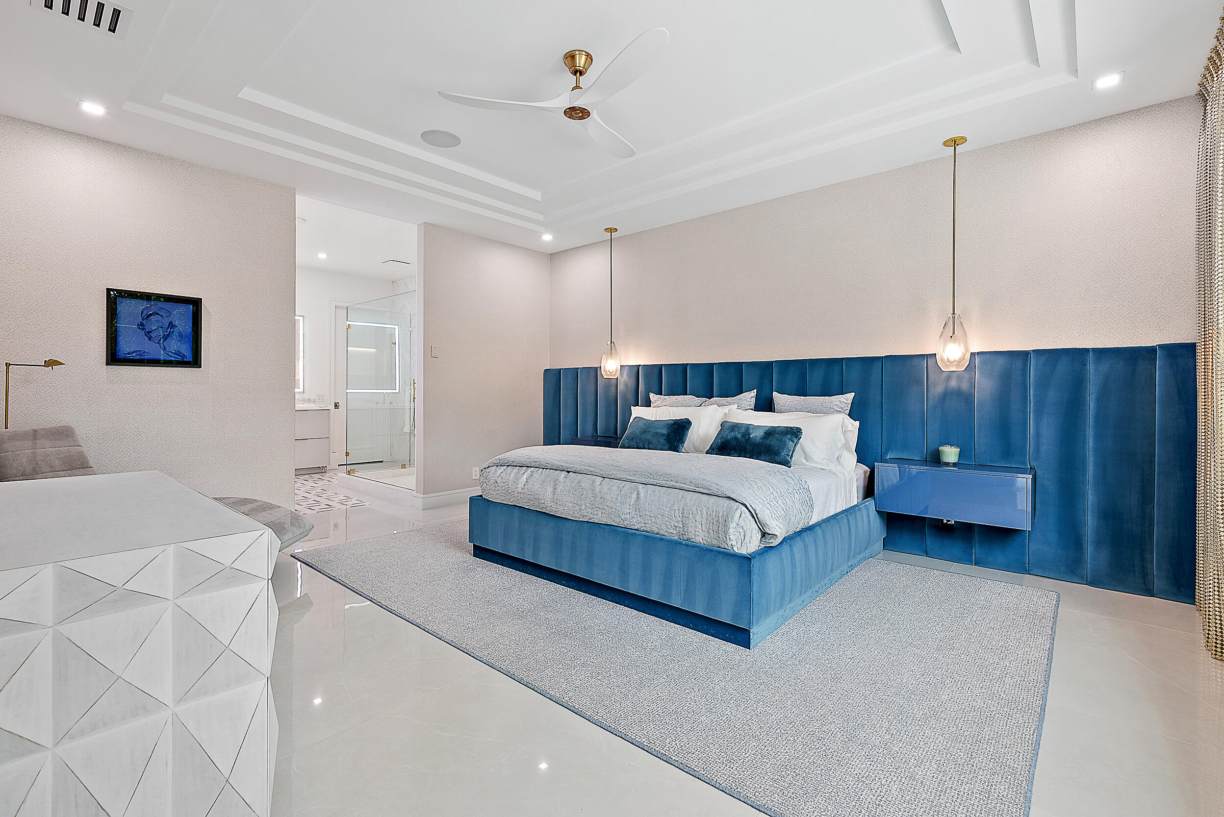 134 Golf Village Boulevard Jupiter, FL 33458 - Photo 17 of 48 a bedroom with a bed a dresser and flowerpot