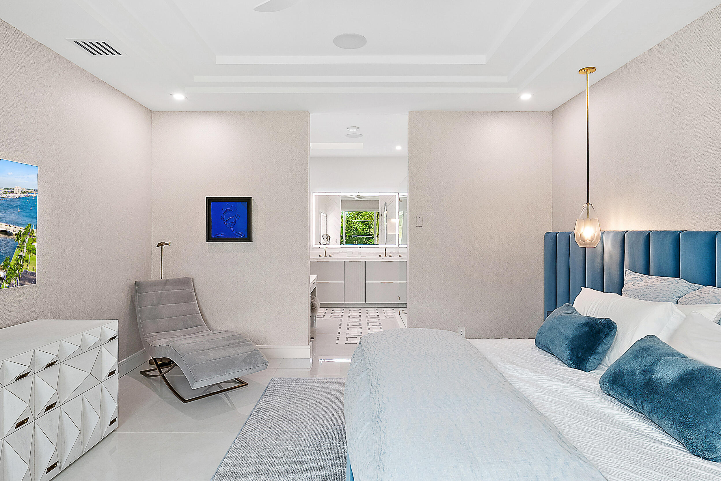 134 Golf Village Boulevard Jupiter, FL 33458 - Photo 18 of 48 a bedroom with a bed and a couch