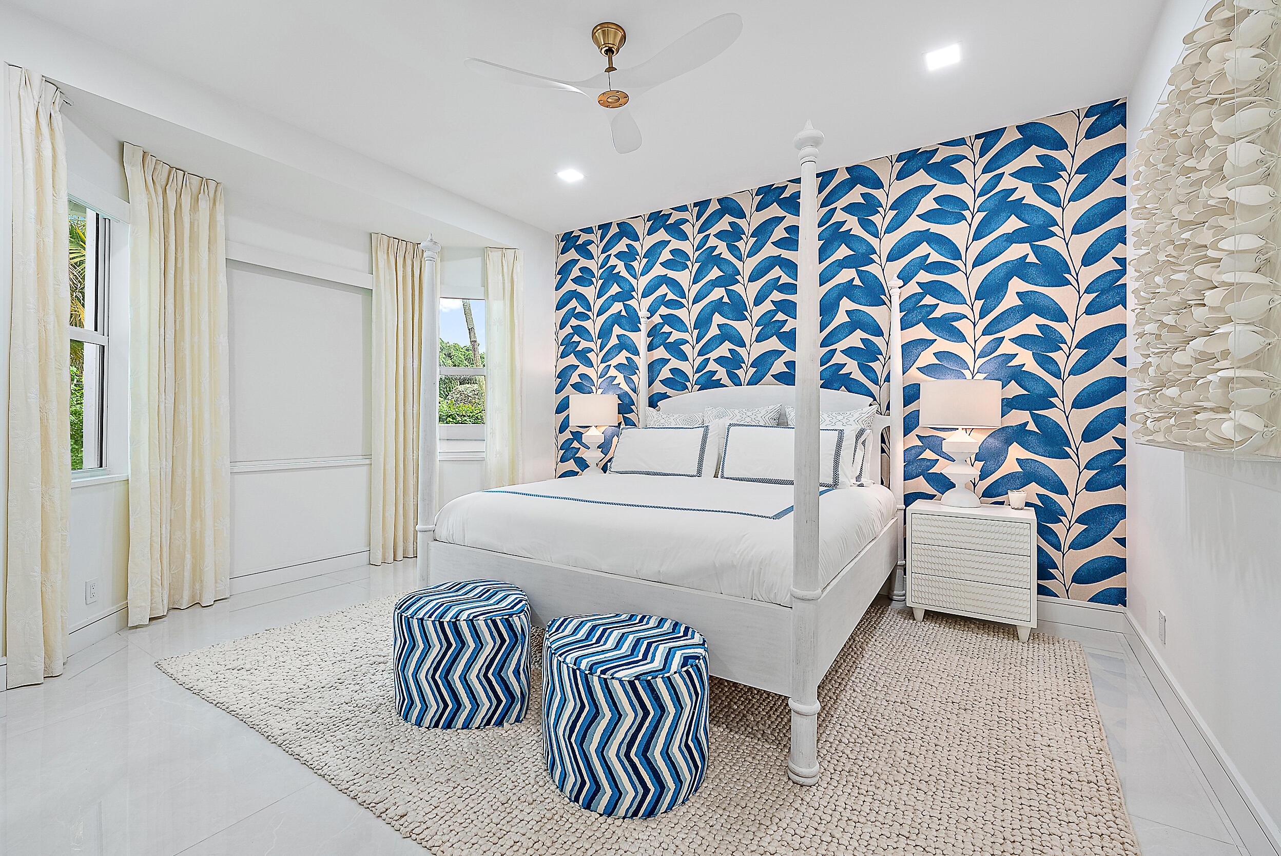 134 Golf Village Boulevard Jupiter, FL 33458 - Photo 21 of 48 a bedroom with a bed and a chair