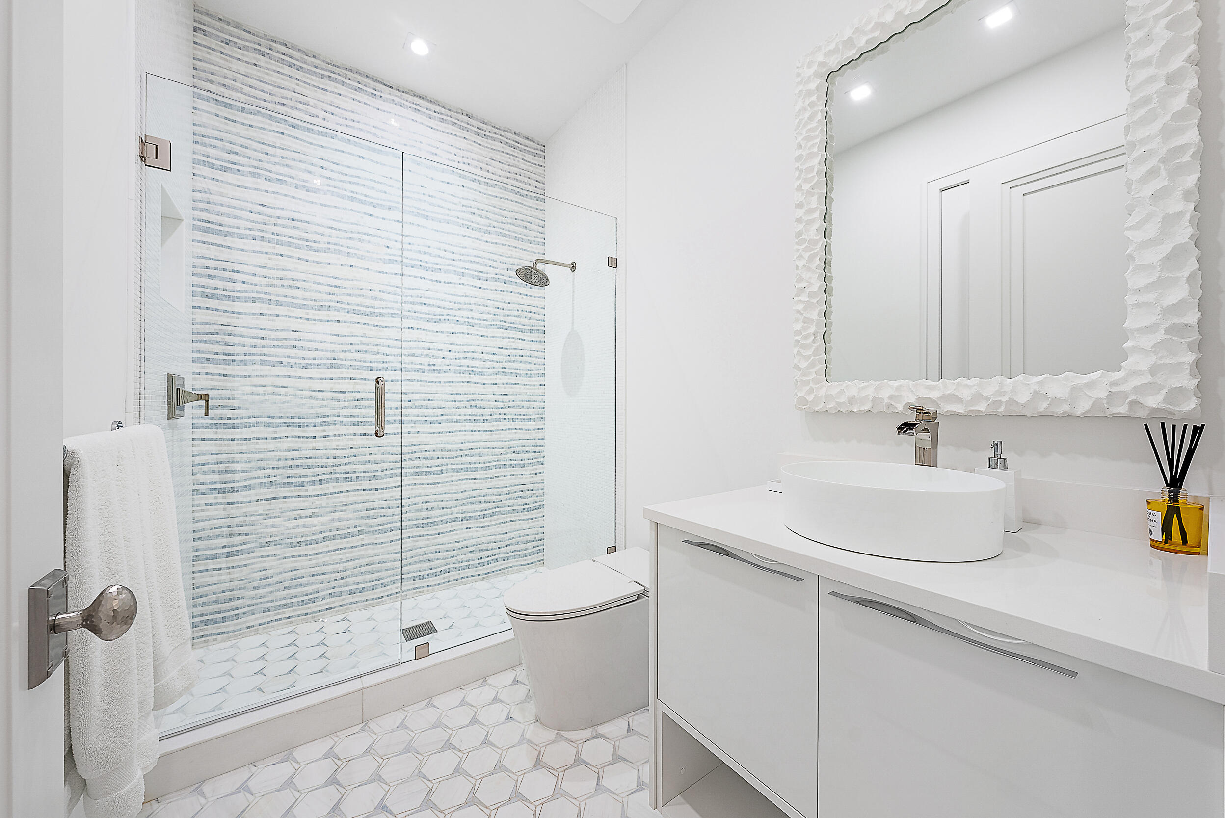 134 Golf Village Boulevard Jupiter, FL 33458 - Photo 22 of 48 a bathroom with a sink a toilet and shower