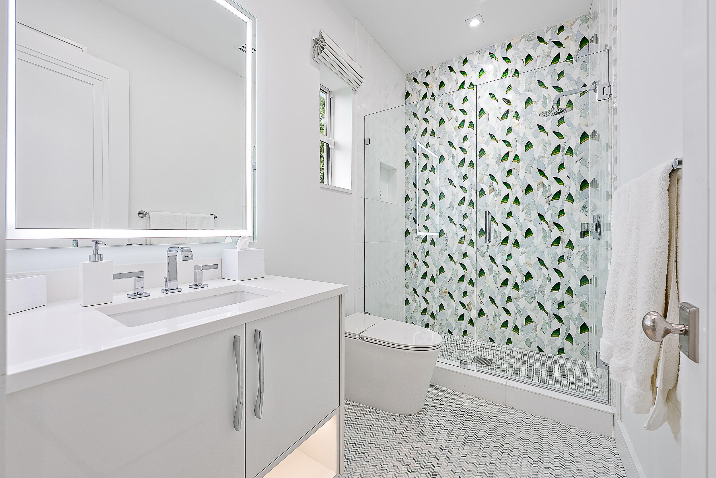 134 Golf Village Boulevard Jupiter, FL 33458 - Photo 25 of 48 a bathroom with a sink toilet and shower