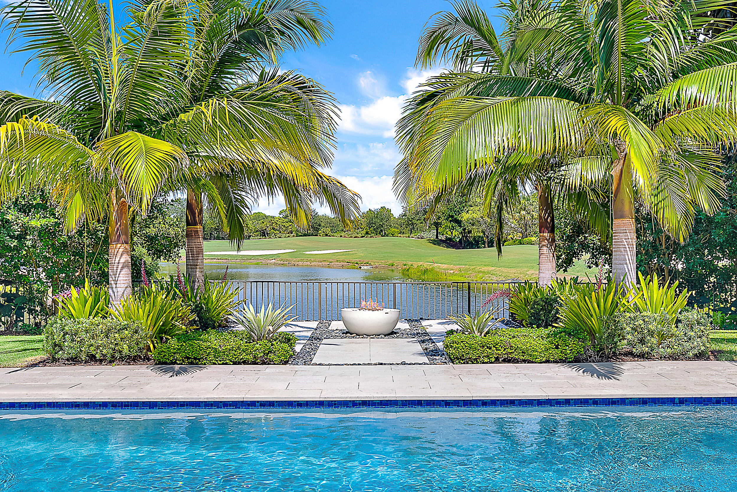 134 Golf Village Boulevard Jupiter, FL 33458 - Photo 4 of 48 a view of a yard with a palm trees
