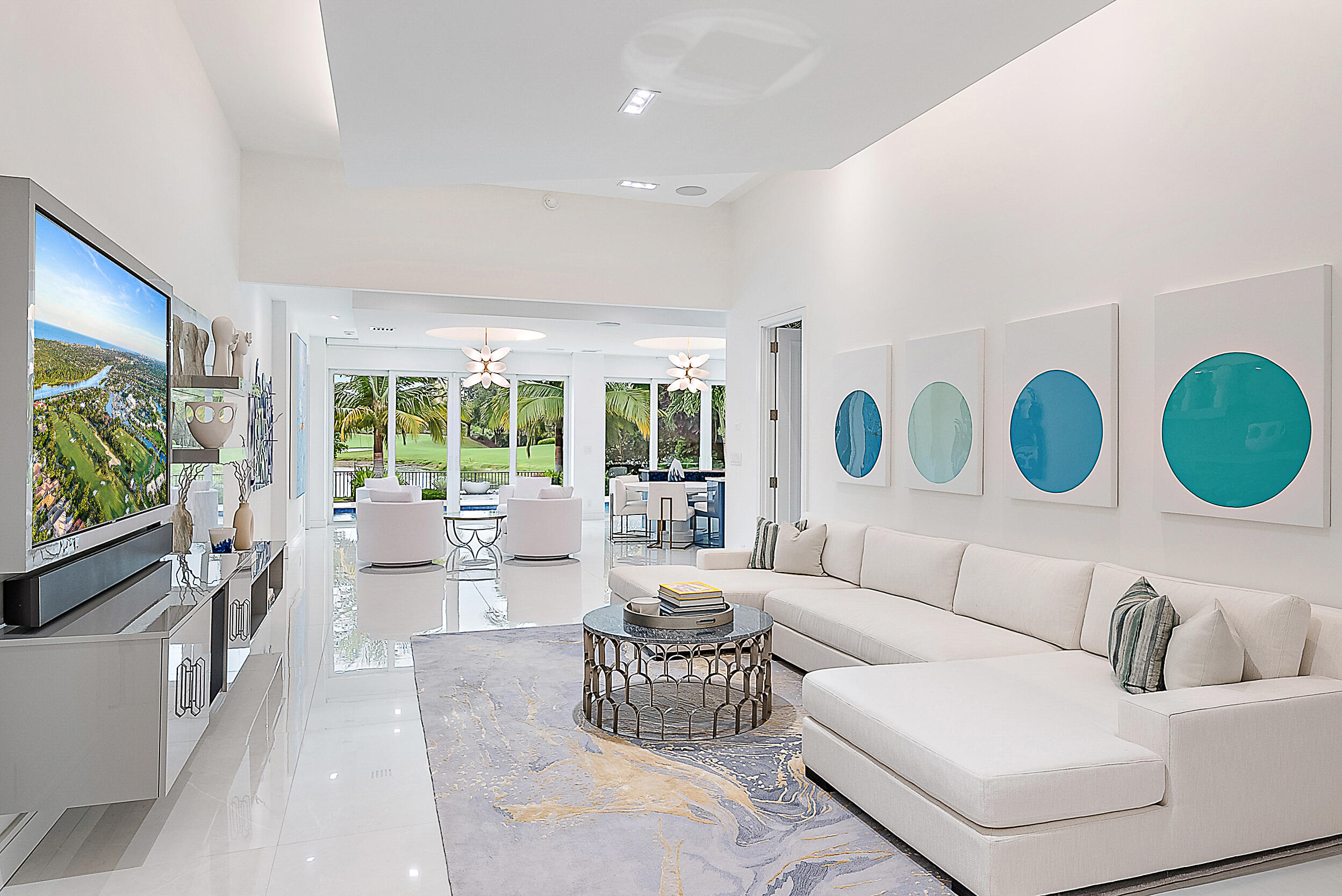 134 Golf Village Boulevard Jupiter, FL 33458 - Photo 7 of 48 a living room with furniture and a large window