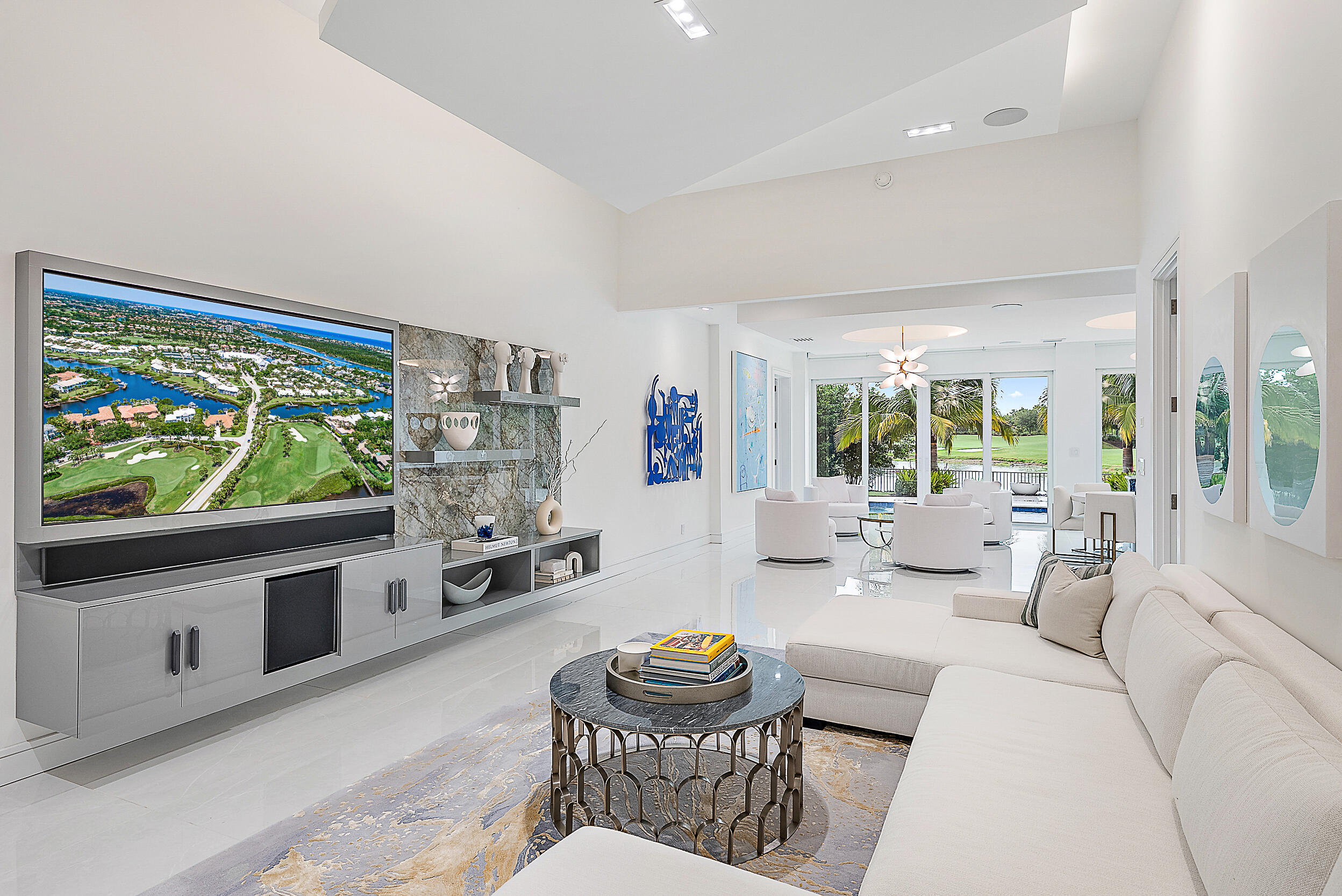 134 Golf Village Boulevard Jupiter, FL 33458 - Photo 8 of 48 a living room with fireplace furniture and a flat screen tv