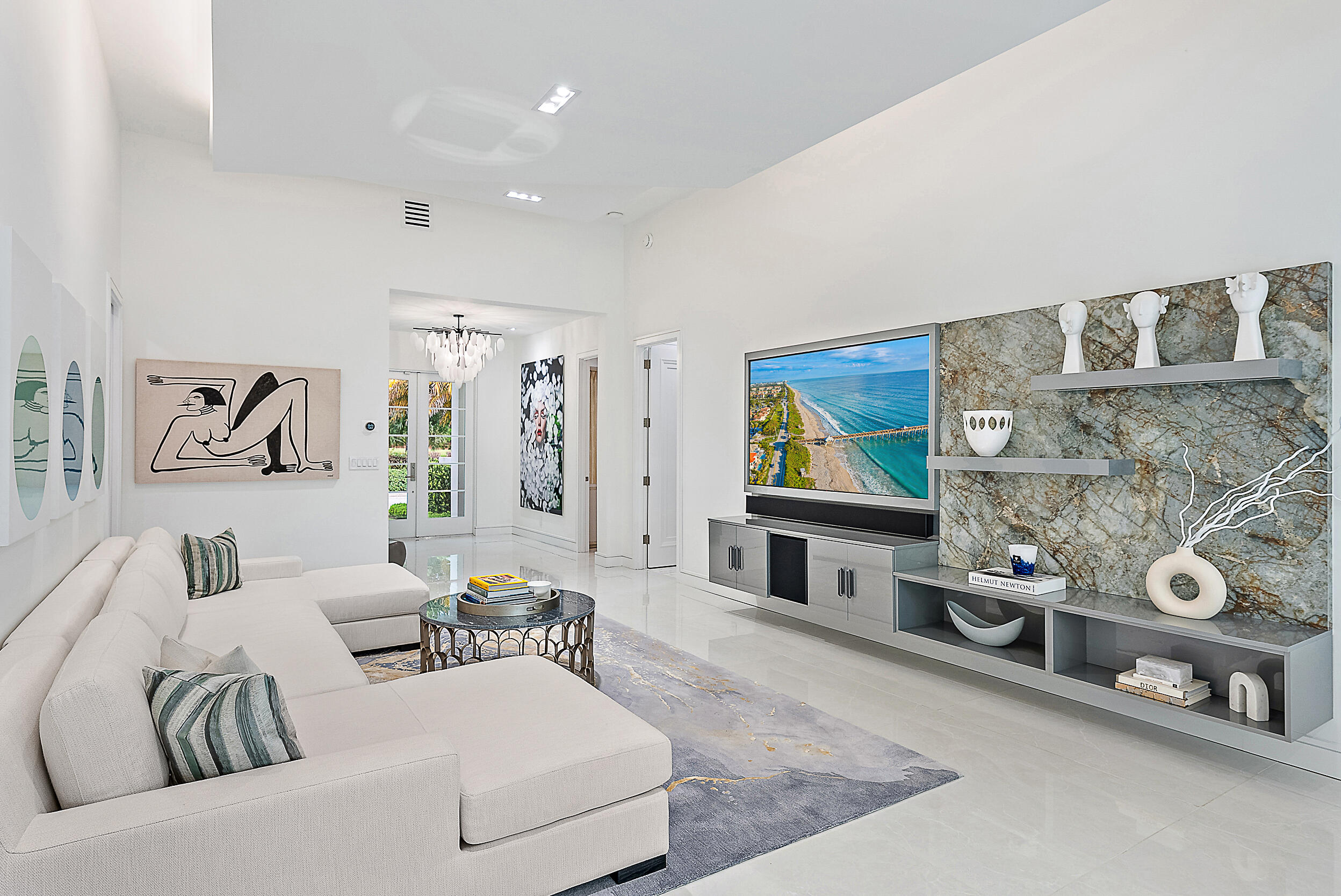 134 Golf Village Boulevard Jupiter, FL 33458 - Photo 9 of 48 a living room with furniture and a flat screen tv