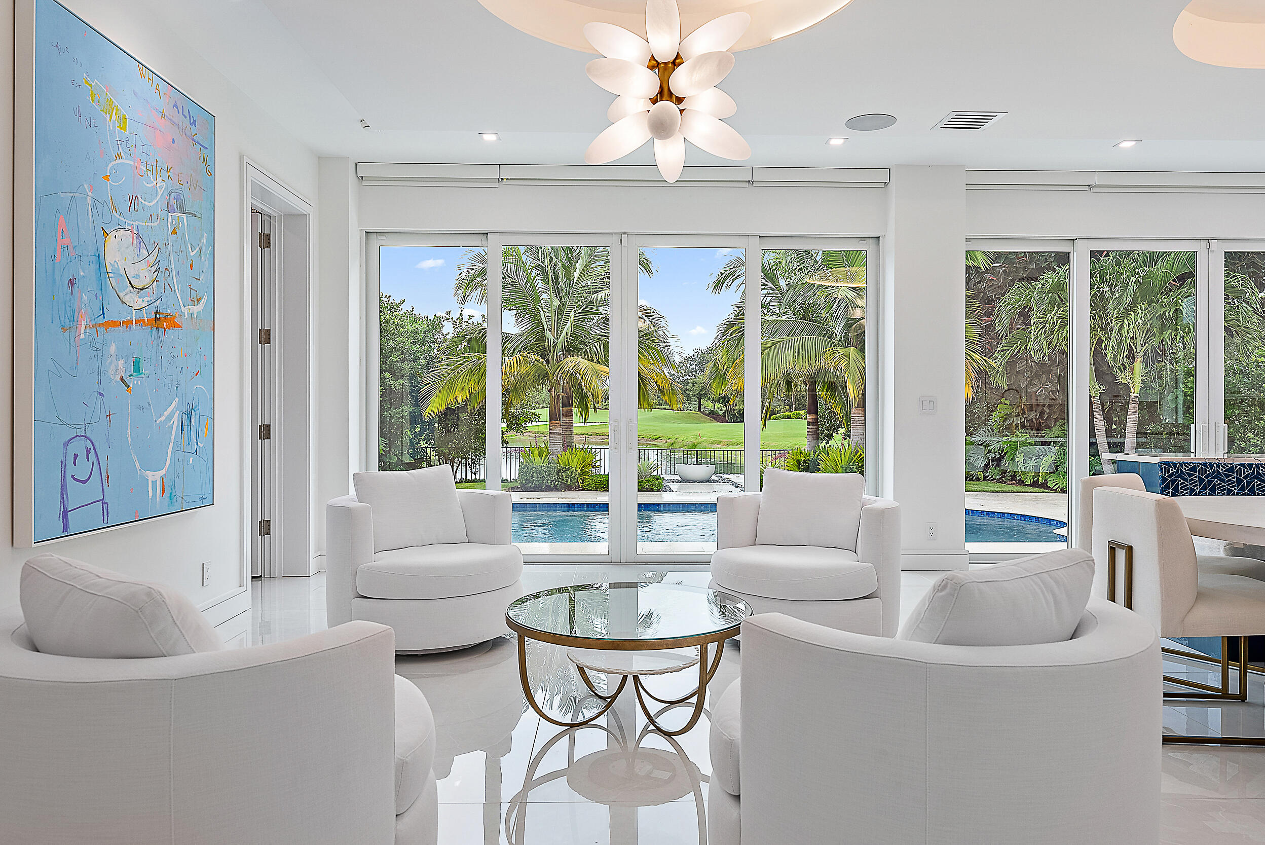 134 Golf Village Boulevard Jupiter, FL 33458 - Photo 10 of 48 a living room with furniture and a large window