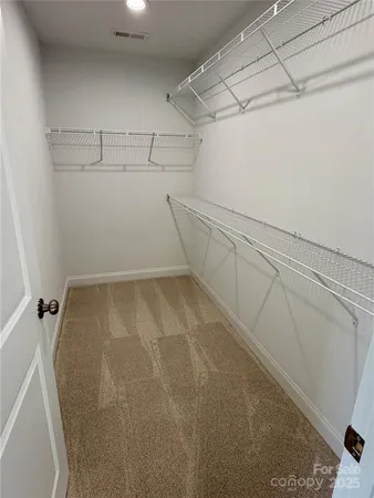 a view of a room with racks on the wall