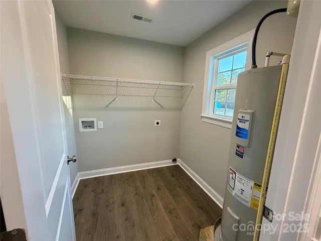 a front view of a house with yard porch and garage