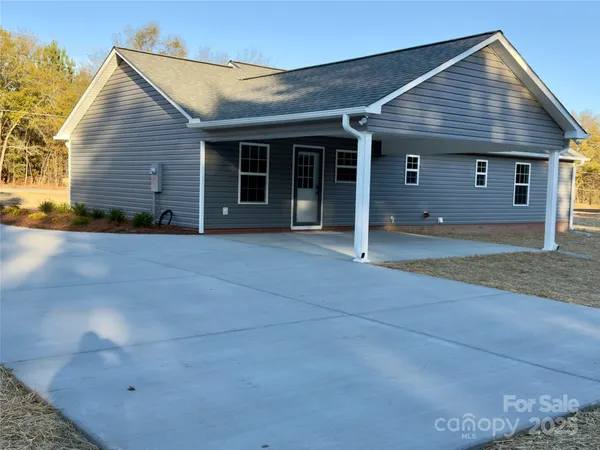 a front view of a house with a garage