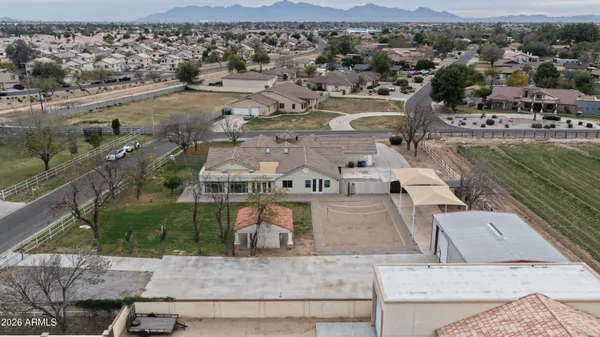 an aerial view of residential houses with outdoor space