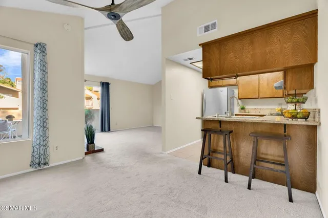 a kitchen with stainless steel appliances a sink and a stove