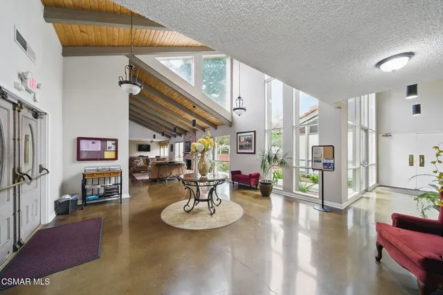 a view of a dining room with furniture window and outside view