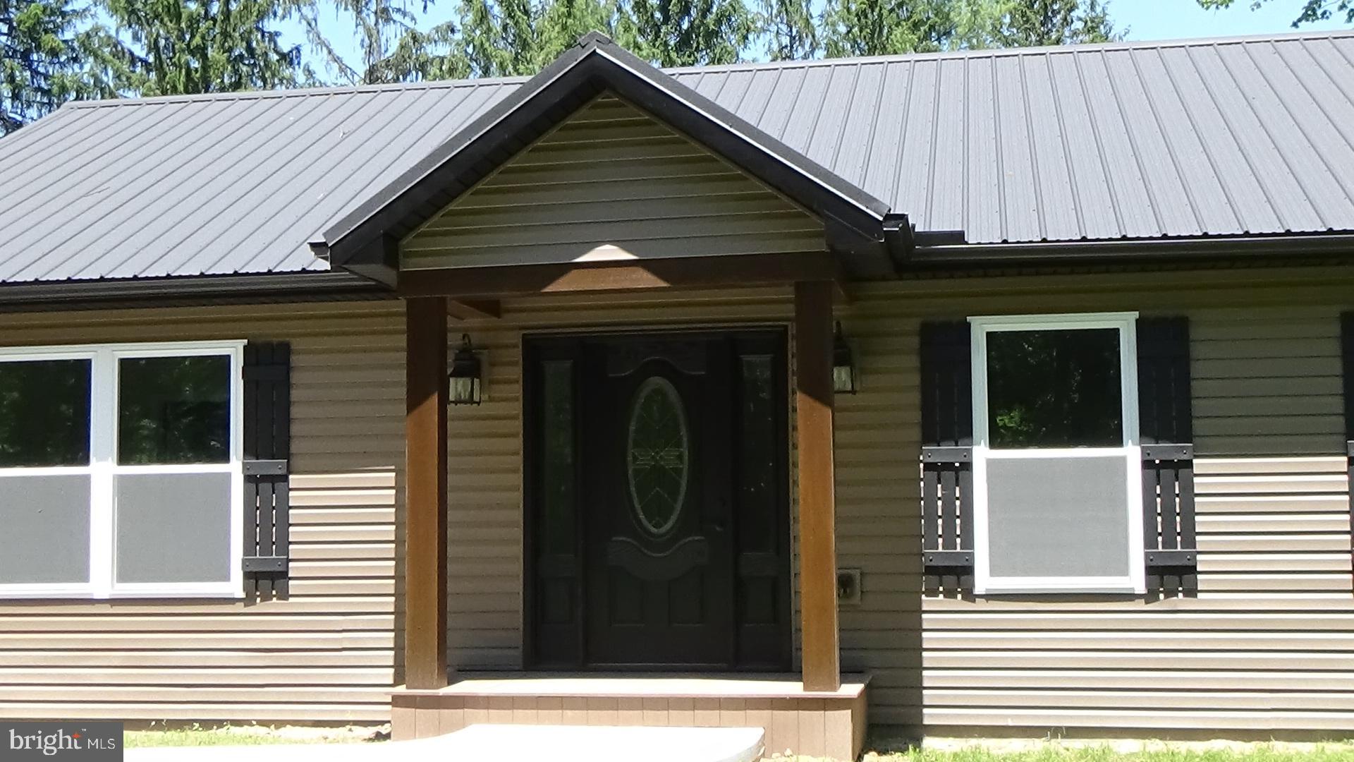 130 Soule Road New Bloomfield, PA 17068 - Photo 18 of 18 a front view of a house with a garden