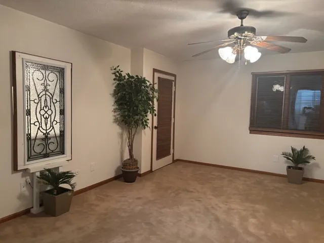 a spacious bathroom with a sink and a mirror