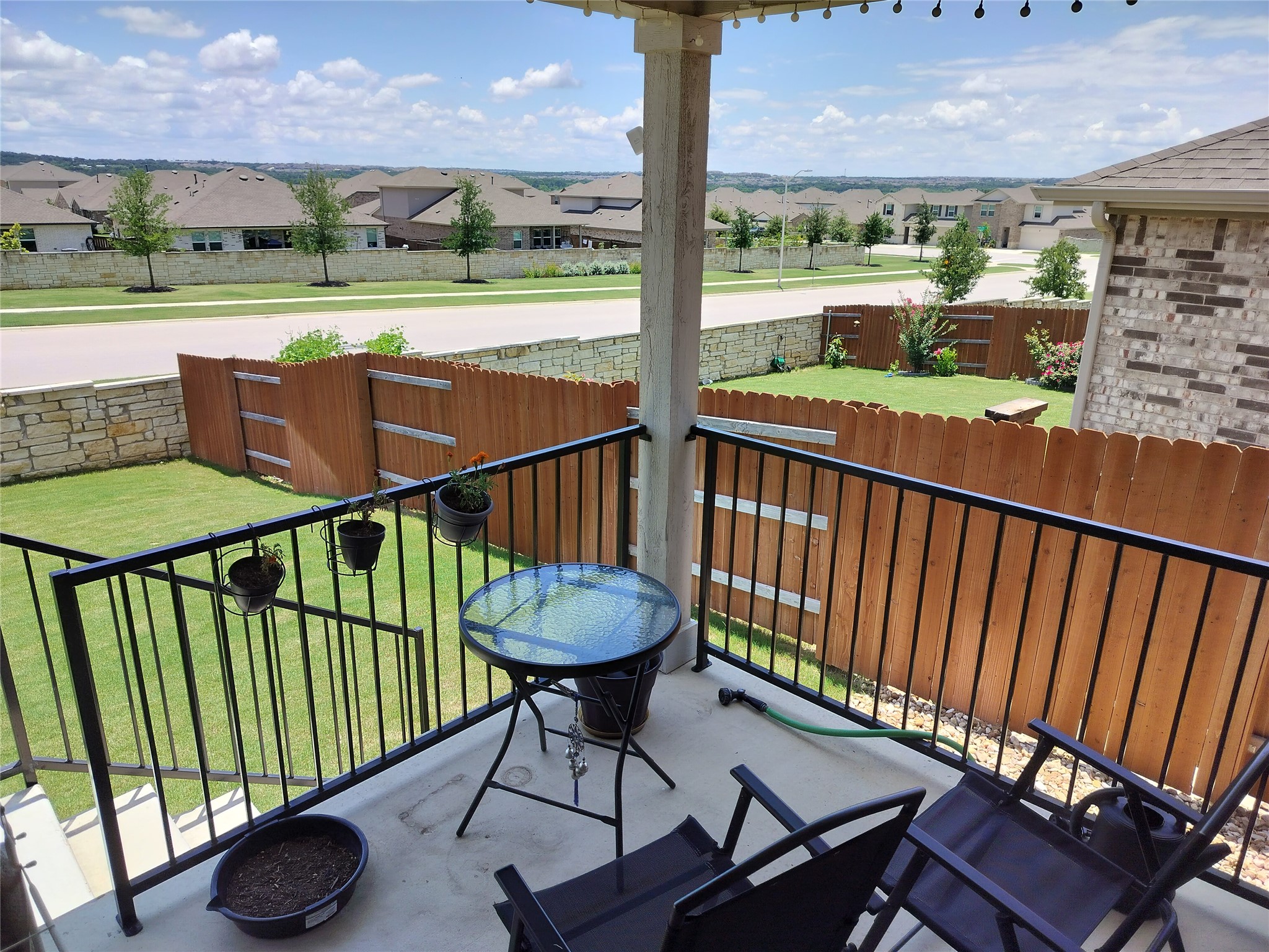 2412 Lightning View Leander, TX 78641 - Photo 20 of 24 A charming patio offers a pleasant spot to relax with views of the fenced yard and neighborhood.