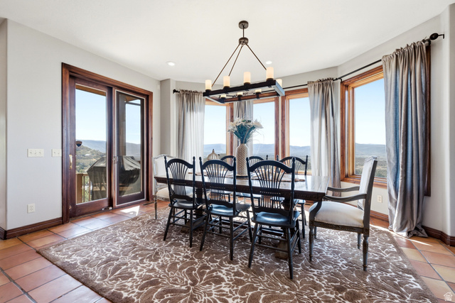 335 Bern Way Midway, UT 84049 - Photo 24 of 88 Dining area with terracotta-style tile flooring and a large area rug