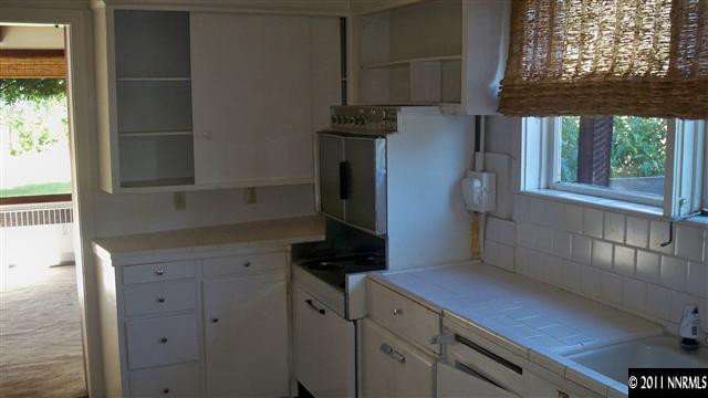 45 Suda Way Reno, NV 89509 - Photo 6 of 13 a kitchen with a refrigerator and a window
