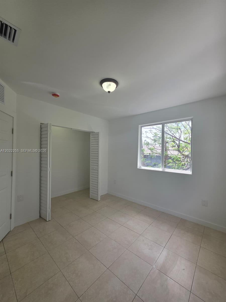 829 Southwest 3rd Street, Unit 831 Miami, FL 33130 - Photo 9 of 21 a view of an empty room with a window