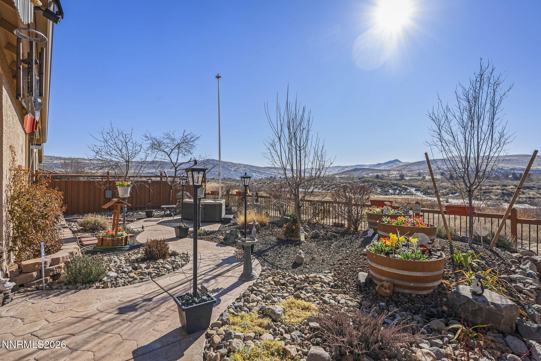 6787 Centaurus Drive Sparks, NV 89436 - Photo 27 of 39 a view of a terrace with chairs and potted plants
