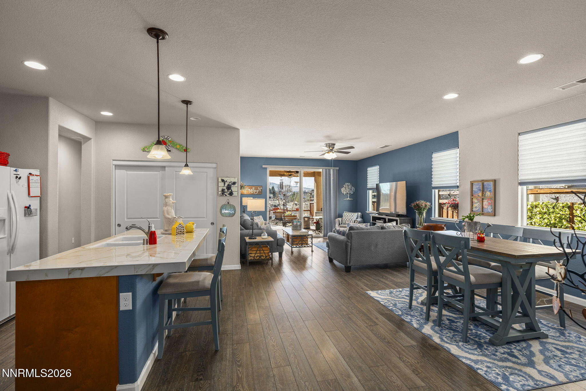6787 Centaurus Drive Sparks, NV 89436 - Photo 3 of 39 a view of a dining room with furniture window and wooden floor