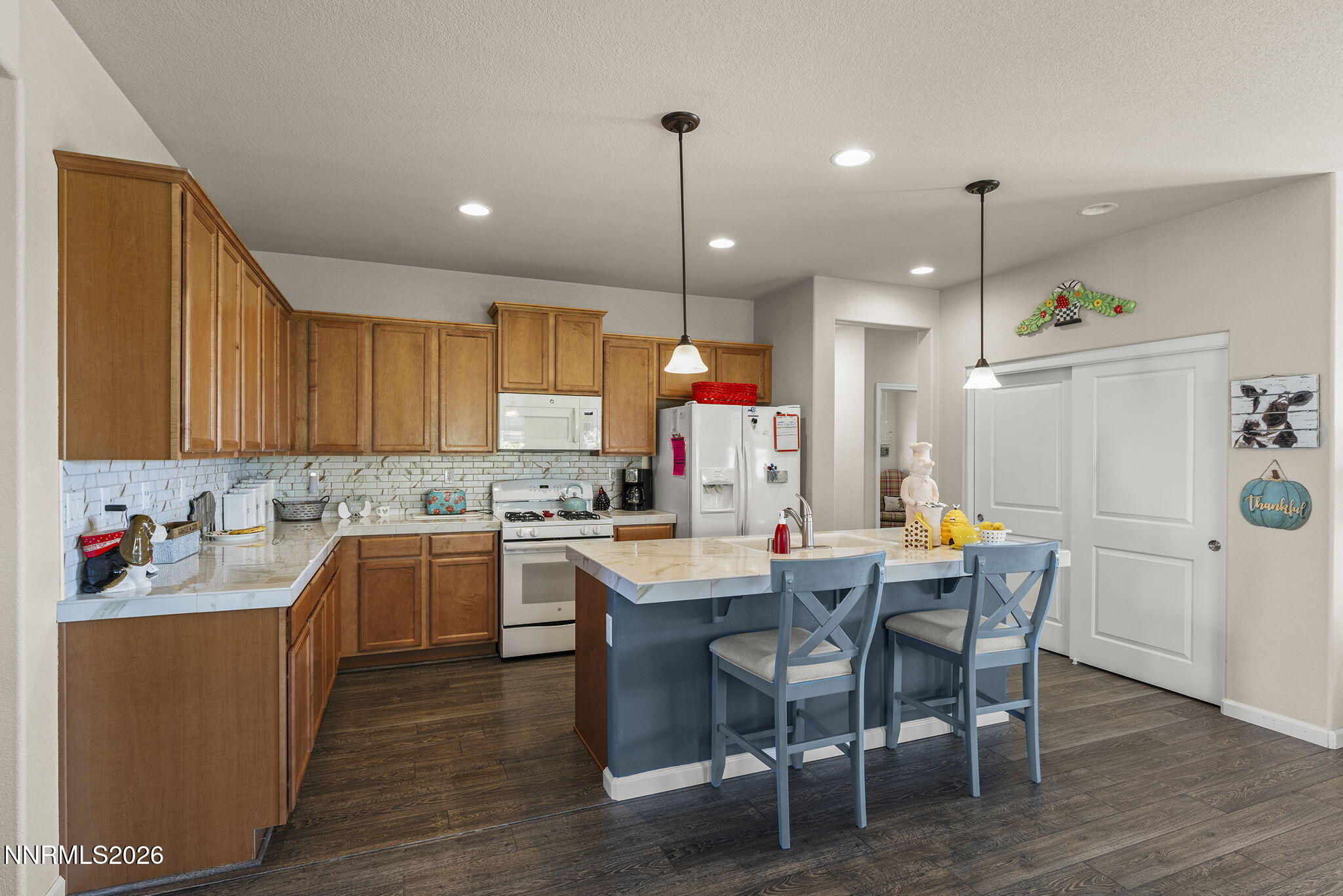 6787 Centaurus Drive Sparks, NV 89436 - Photo 5 of 39 a kitchen that has a cabinets counter space and appliances