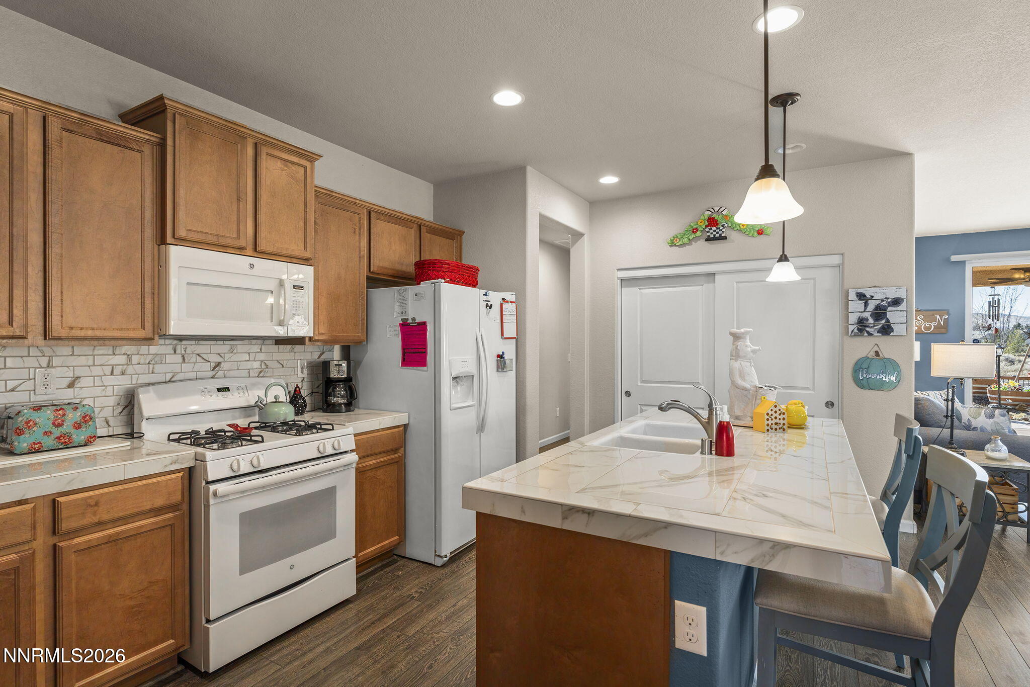 6787 Centaurus Drive Sparks, NV 89436 - Photo 7 of 39 a kitchen that has a lot of cabinets in it and appliances