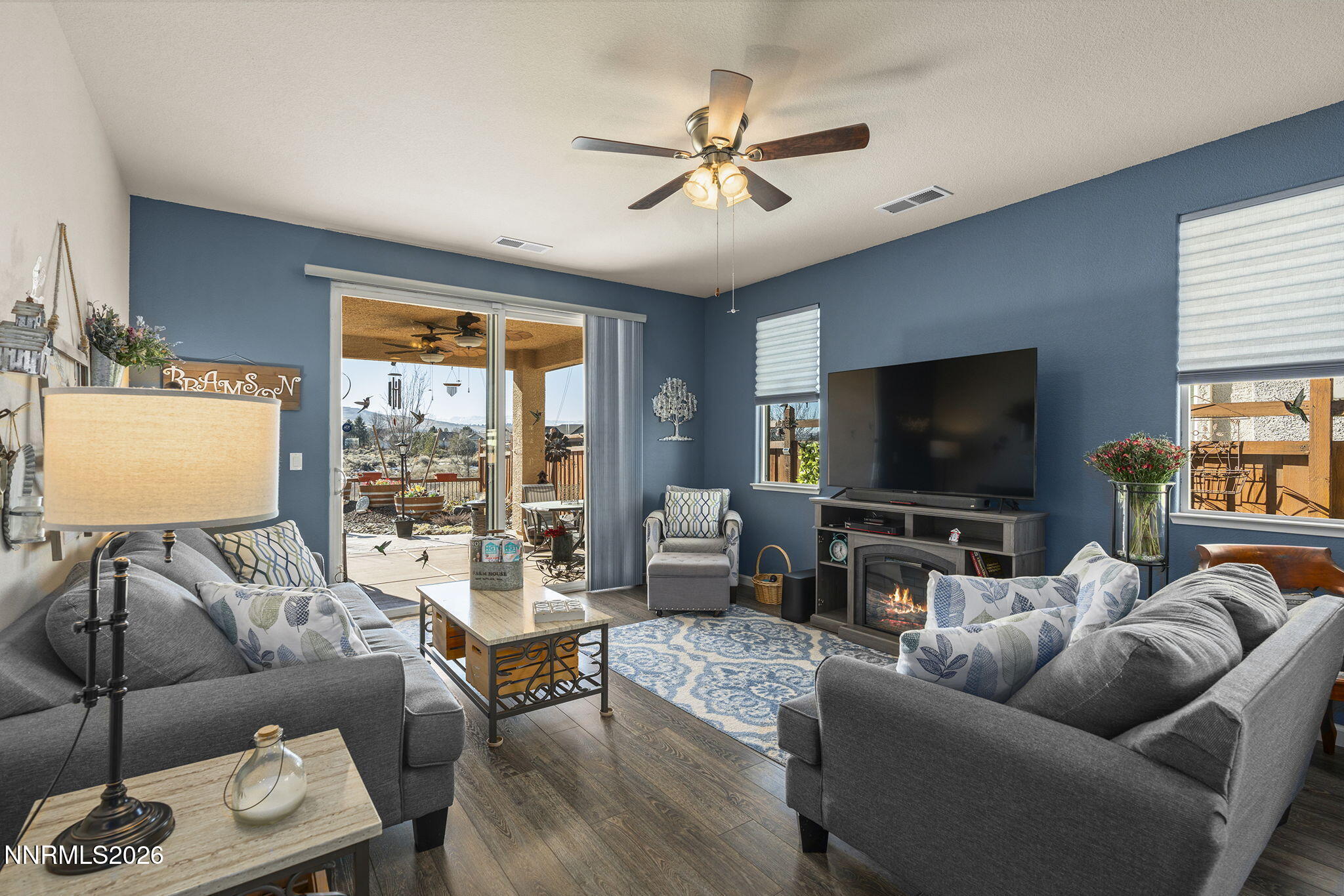 6787 Centaurus Drive Sparks, NV 89436 - Photo 8 of 39 a living room with furniture and a flat screen tv