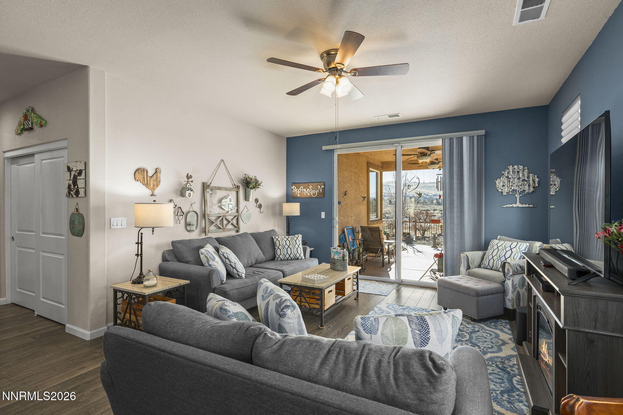 6787 Centaurus Drive Sparks, NV 89436 - Photo 9 of 39 a living room with furniture ceiling fan and a window