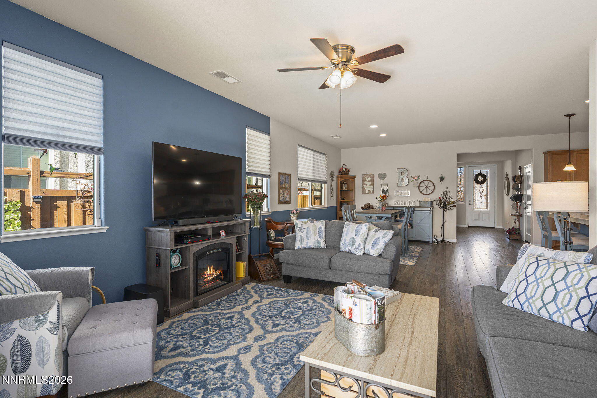 6787 Centaurus Drive Sparks, NV 89436 - Photo 10 of 39 a living room with furniture and a flat screen tv