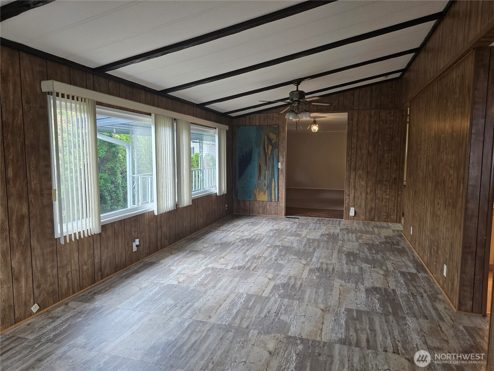 620 112th Street Southeast, Unit 323 Everett, WA 98208 - Photo 2 of 14 a view of an empty room with wooden floor and a window