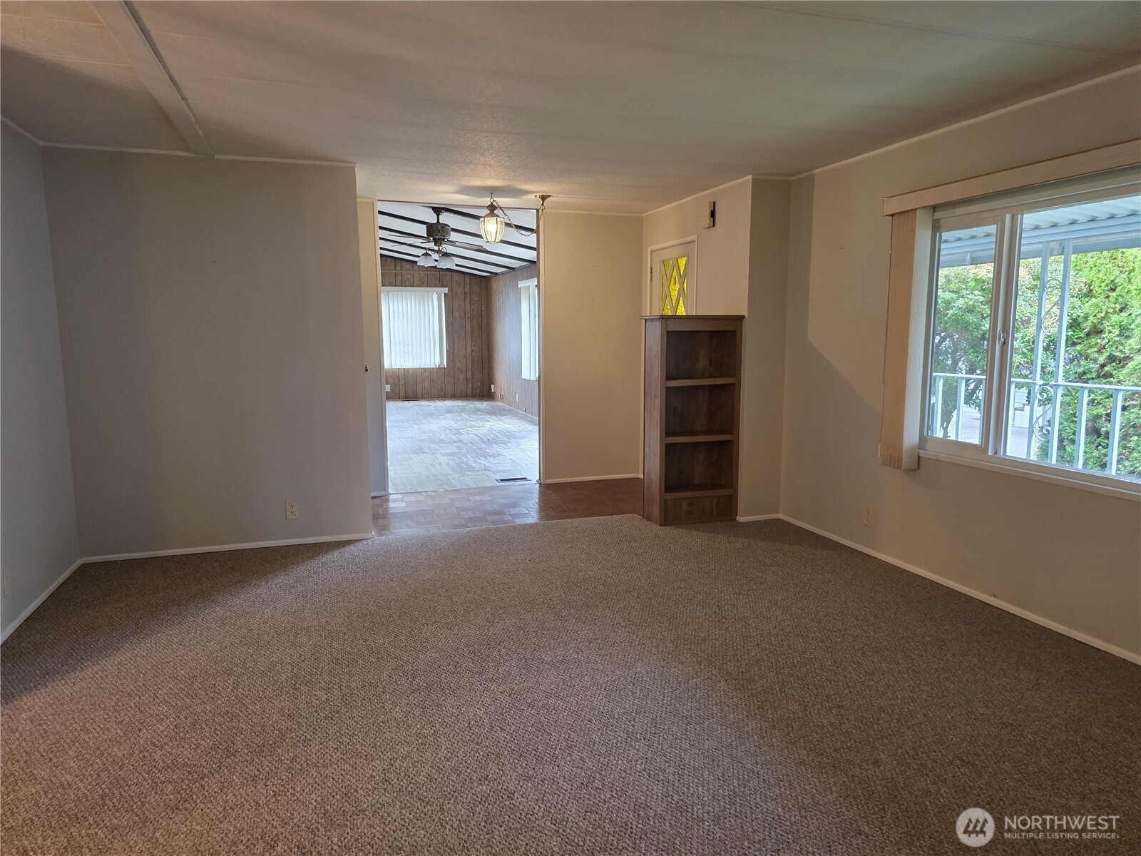 620 112th Street Southeast, Unit 323 Everett, WA 98208 - Photo 3 of 14 a view of a livingroom with furniture and an empty room
