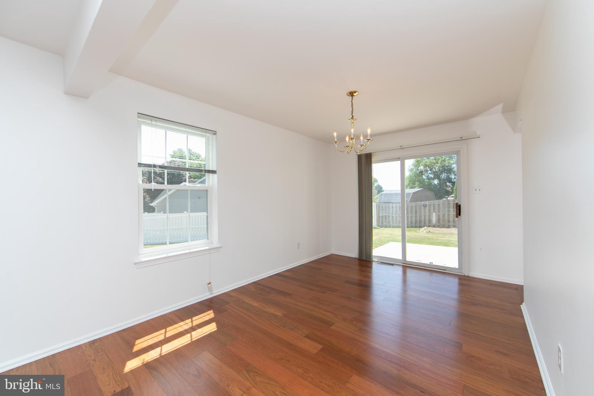 3007 Rampart Road Bensalem, PA 19020 - Photo 11 of 48 an empty room with wooden floor and windows
