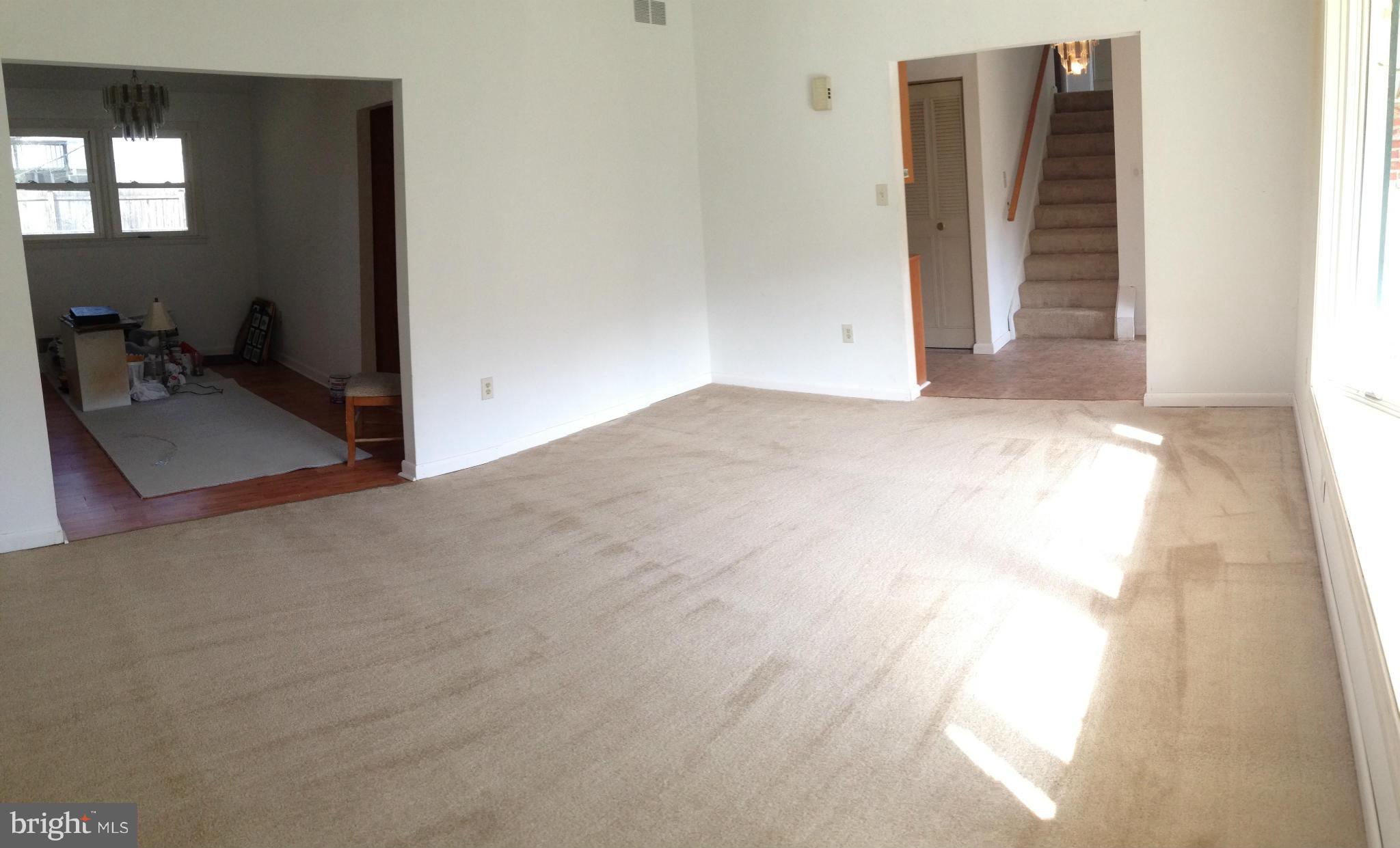 1616 Hopefield Road Silver Spring, MD 20905 - Photo 12 of 22 a view of a livingroom with wooden floor and a window